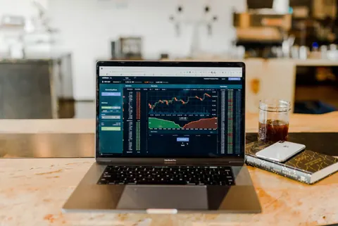 Market charts open on a laptop